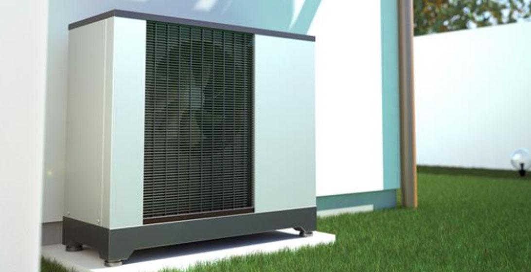 Photograph of a heat pump outside a building