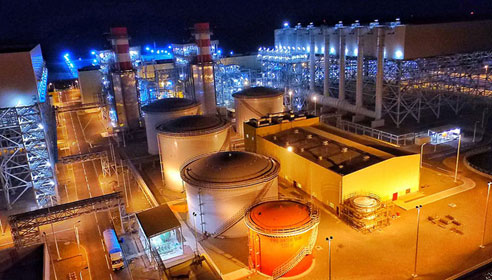 Photograph of an energy station taken at night