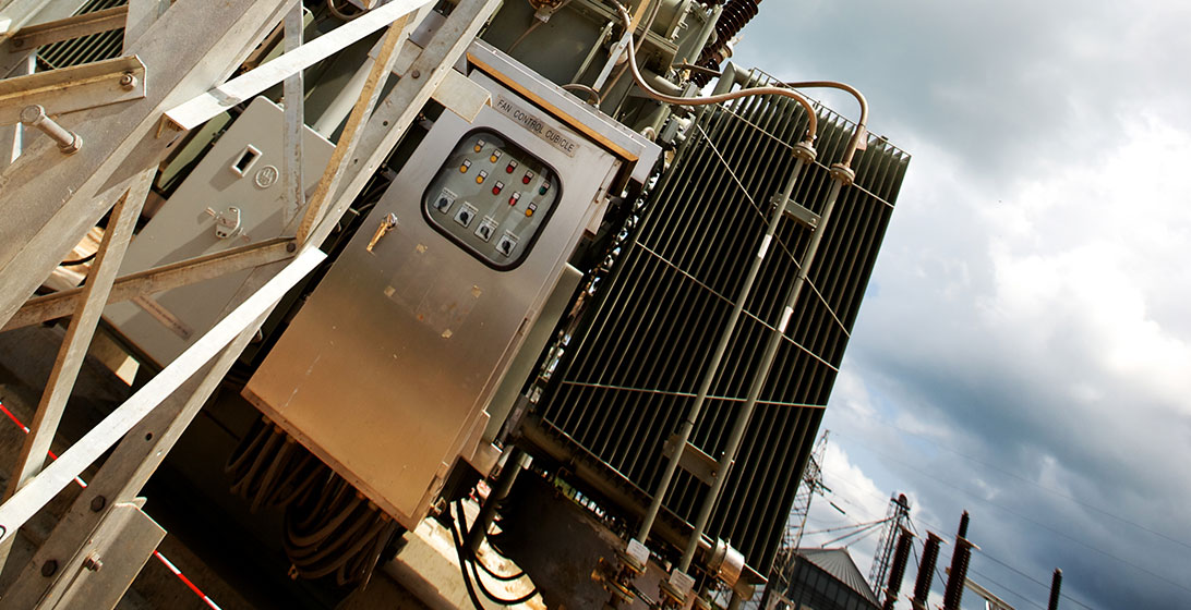 Close up photograph of machinery with a panel of buttons in focus